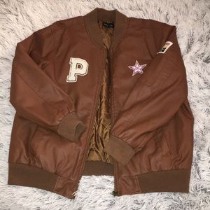 Leather bomber jacket with patches.